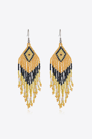 Beaded diamond fringe earrings in yellow, black, and white with boho styling.