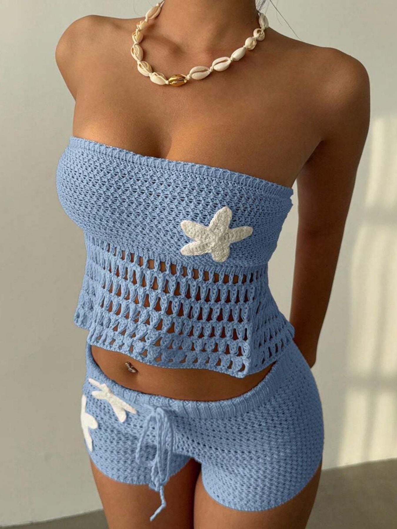Blue crochet tube top and shorts set with white starfish appliques and drawstring shorts.