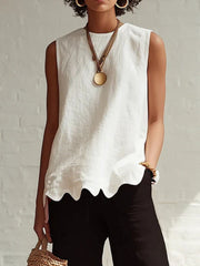 White sleeveless tank top with scalloped hem detail