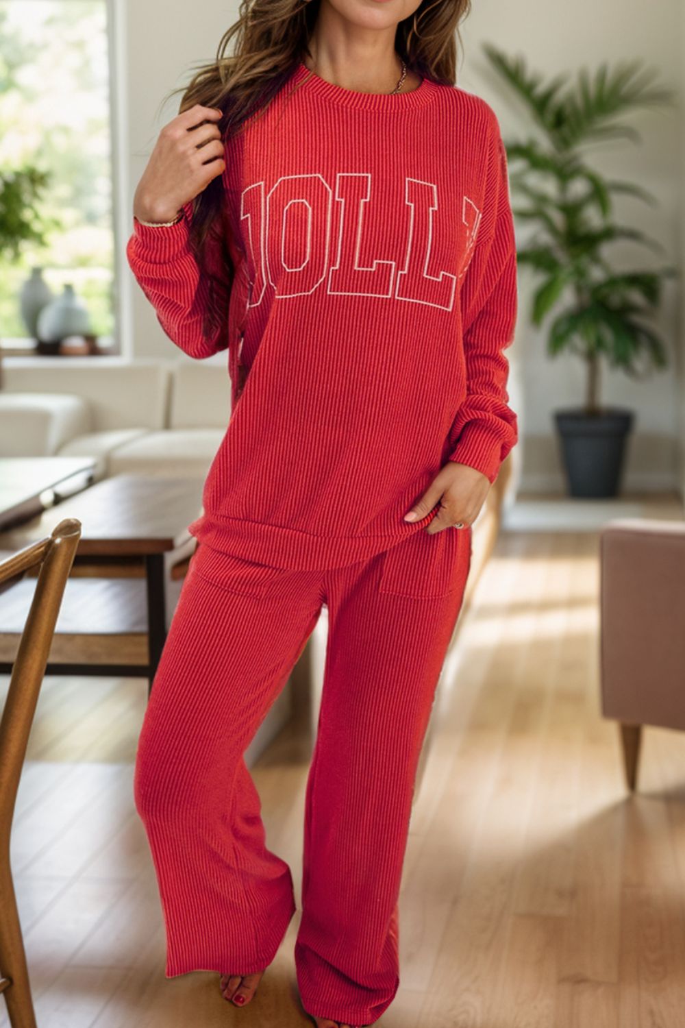 Deep Red ribbed knit lounge set with "JOLLY" graphic sweatshirt and wide-leg pants.