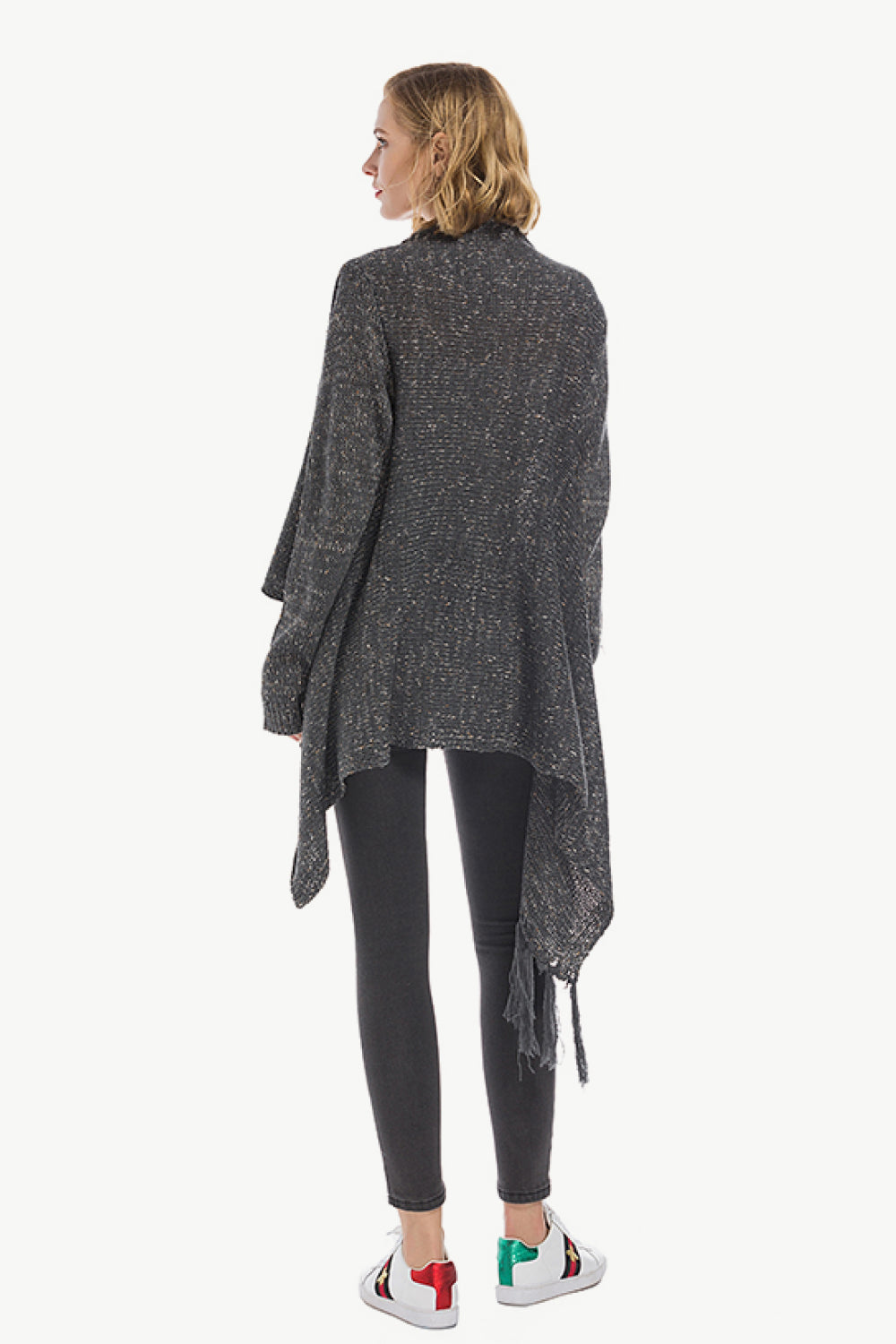 Dark gray asymmetric fringe knit cardigan with button closure and waterfall hem.