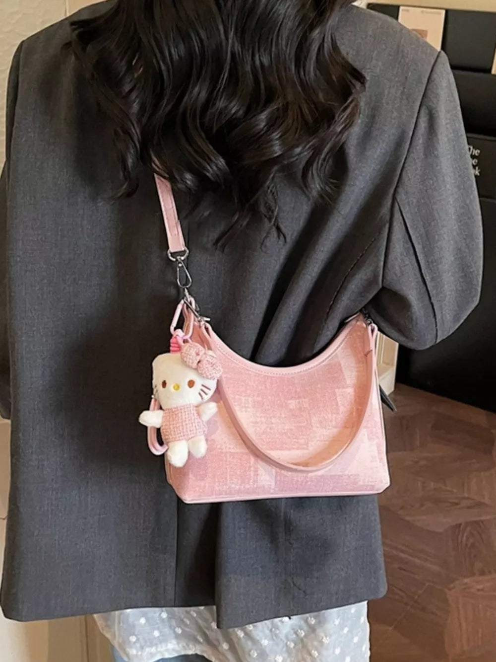 Pink pu leather crescent shoulder bag with Hello Kitty charm