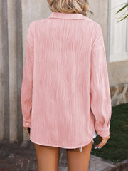 Textured pleated button-down shirt in blush pink with a relaxed fit.