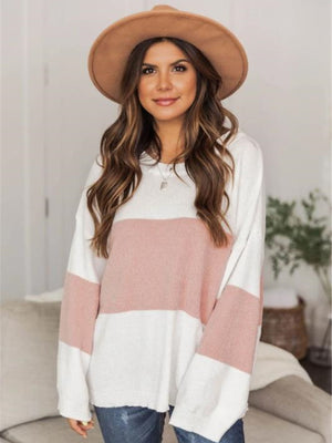 Colorblock knit pullover sweater in blush pink and white with drop shoulders.