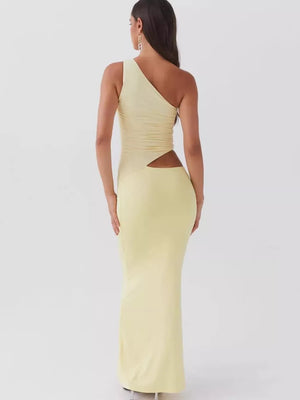 Yellow one-shoulder cutout maxi dress with ruched detail and a cutout at the waist.