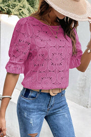 Red-violet floral eyelet blouse with puff sleeves and ruffled cuffs.