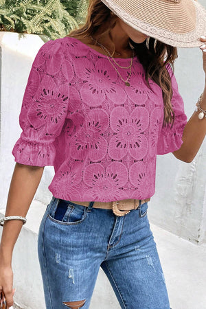 Red-violet floral eyelet blouse with puff sleeves and ruffled cuffs.