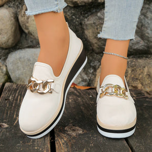Beige chain decor wedge loafers with a textured finish and layered sole.