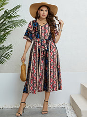 Geometric print midi dress with tie waist, V-neck, and short sleeves in multicolor.
