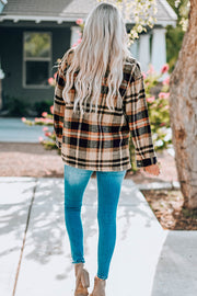 Soft plaid shacket with buttoned front and patch pockets, in tan and black plaid.