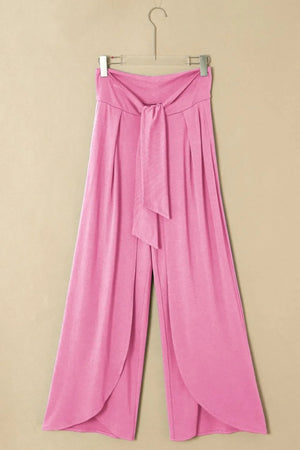 Pink wrap-front palazzo pants with tie waist and slit hem