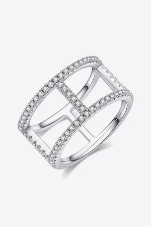 Silver geometric pave moissanite statement ring with crisscross design.