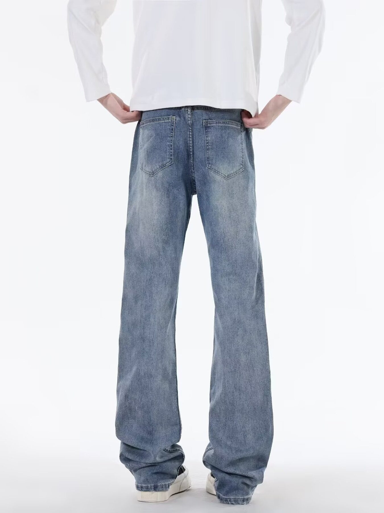 Men's classic blue cotton jeans with five-pocket styling and a relaxed fit.