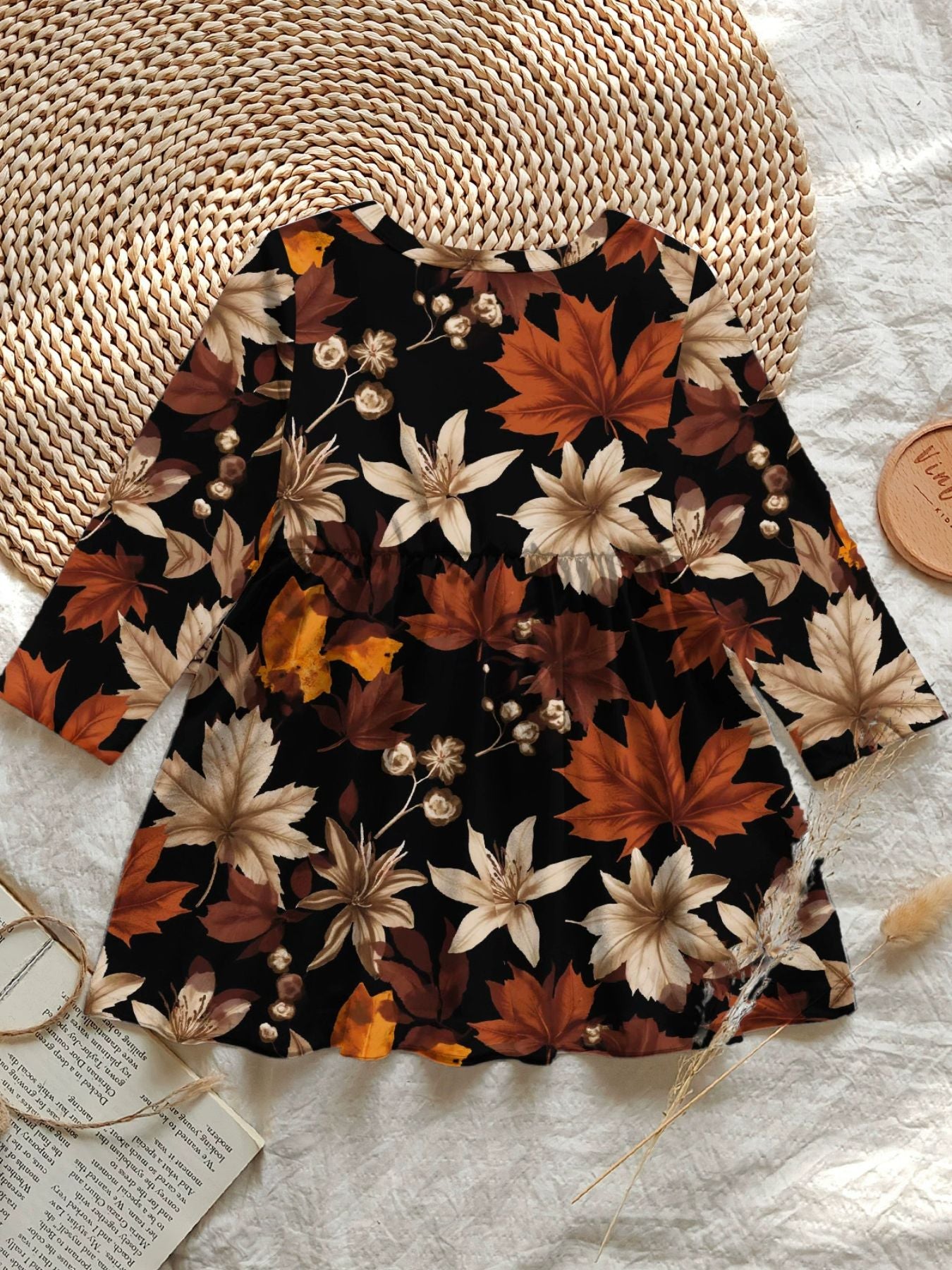 Baby dress with long sleeves and autumn leaf print in black polyester