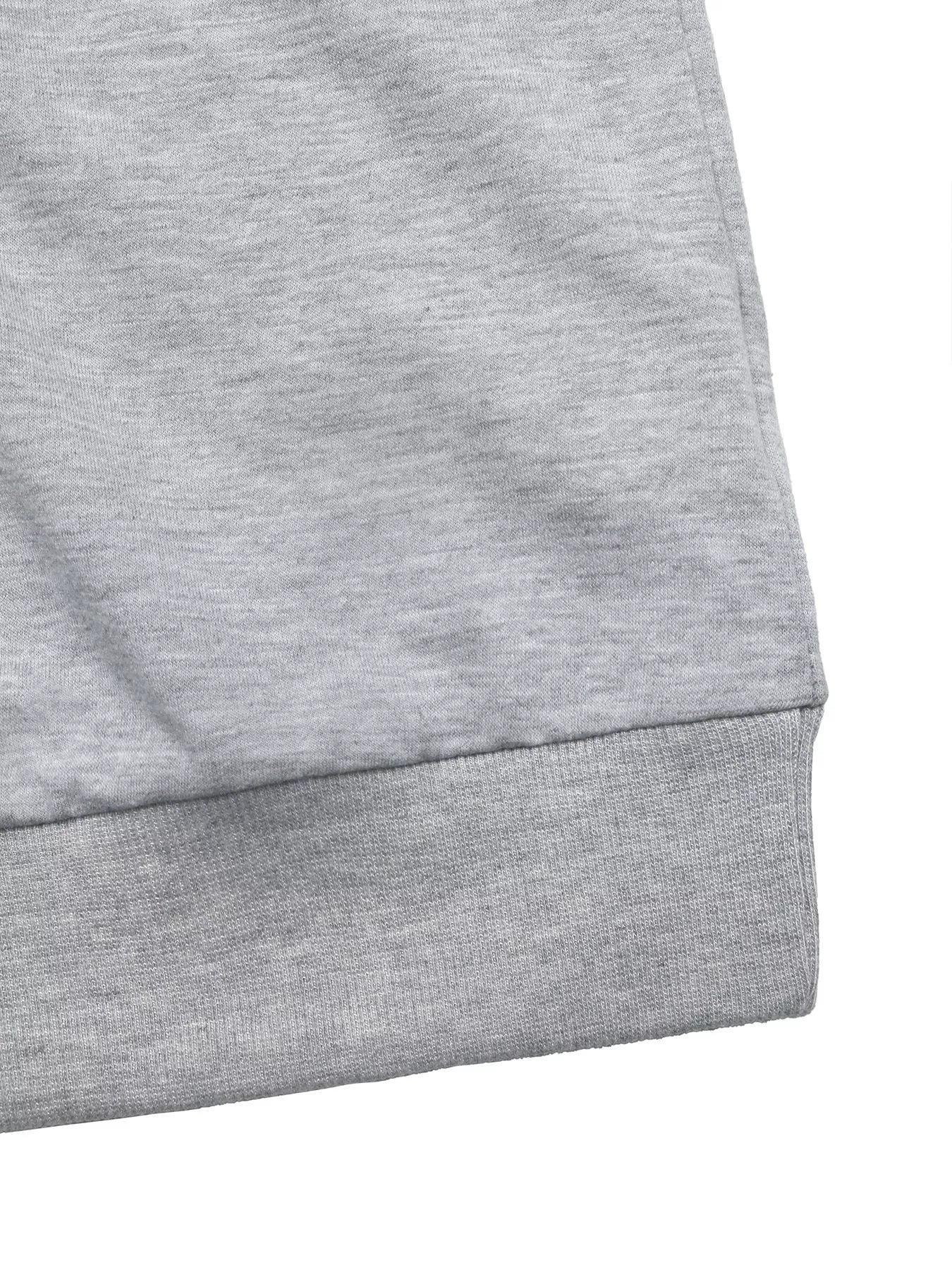 Gray sweater with ribbed hem detail.