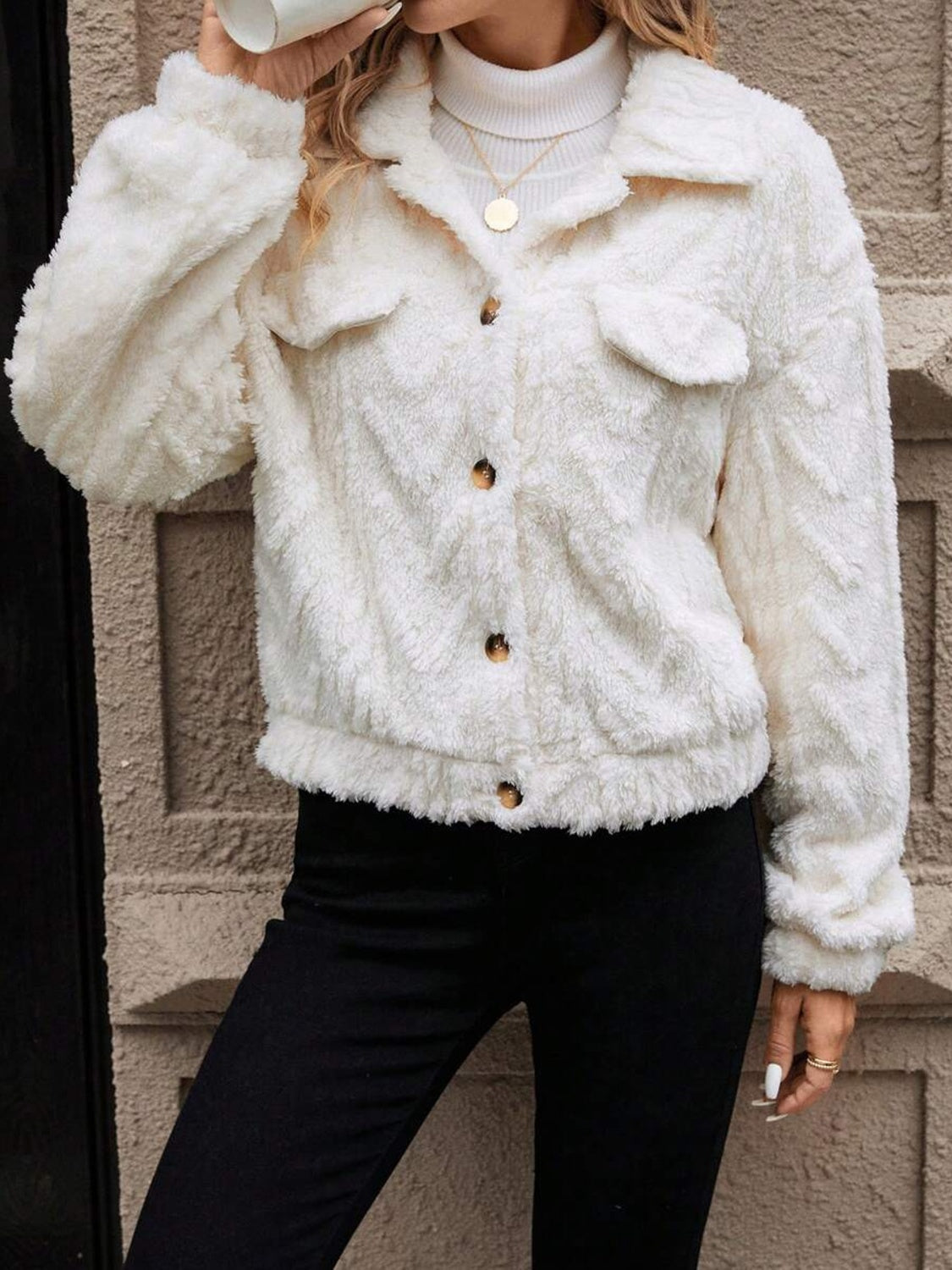 Ivory textured shearling-effect utility jacket with button closures and chest pockets.