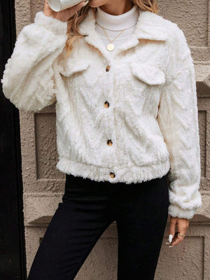 Ivory textured shearling-effect utility jacket with button closures and chest pockets.