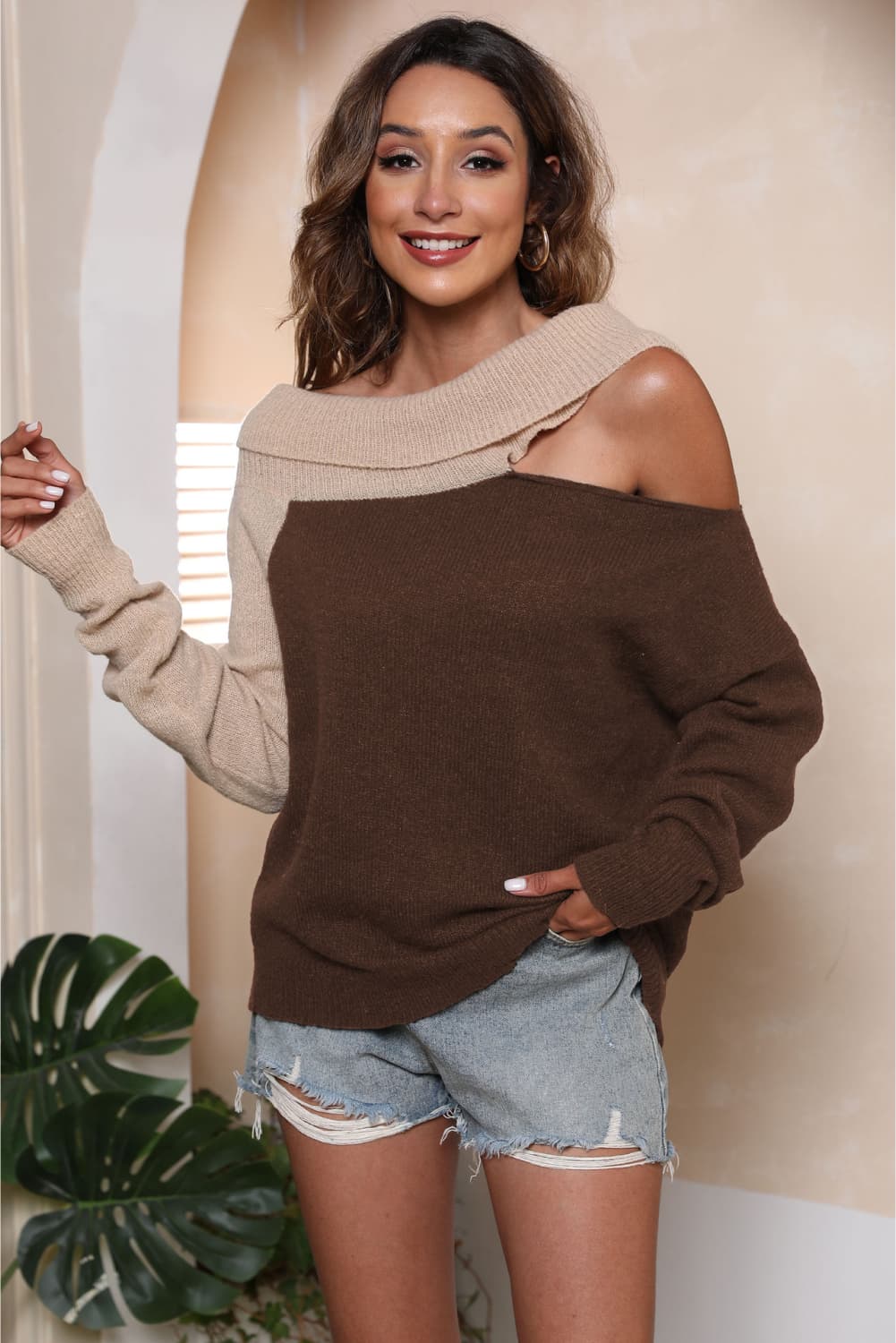 Asymmetric shoulder sweater in mocha and beige acrylic with boat neck.
