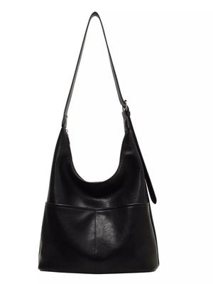 Black hobo shoulder bag with adjustable strap and front pocket detail