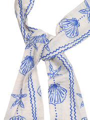 White maternity cover-up romper with blue seashell print and crisscross detail