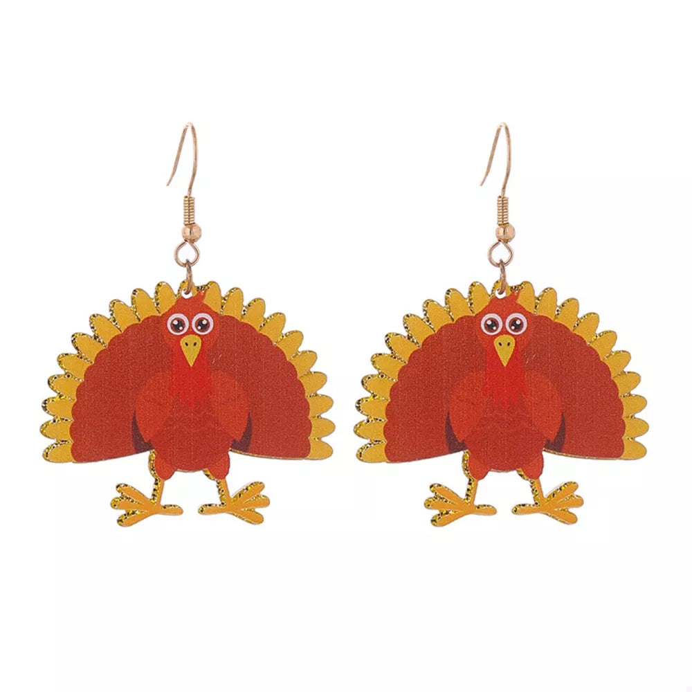 Festive turkey dangle earrings in acrylic with gold accents.
