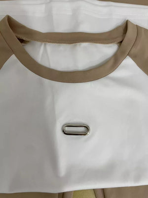 Chic contrast tee and pants set in camel and white with metal detail.