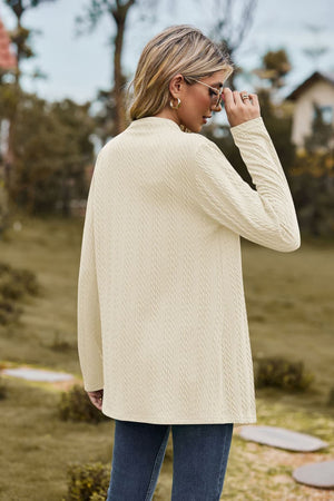 Textured knit cardigan in ivory with a mock neck and long sleeves.