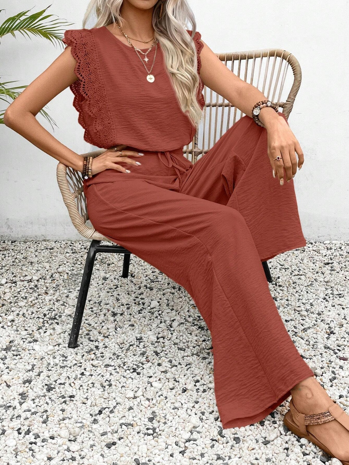 Terracotta textured jumpsuit with ruffle lace sleeves and drawstring waist