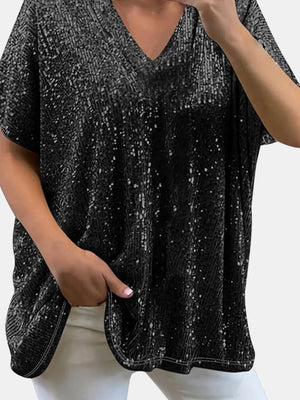 Black sequin V-neck blouse with a slouchy fit and short sleeves.