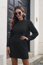 Black cable knit sweater dress with mock neck and defined waist