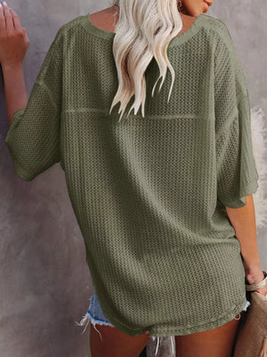 Olive green waffle knit relaxed v-neck t-shirt with short sleeves.