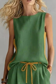 Green tank top and shorts set with yellow contrast trim and drawstring waist.