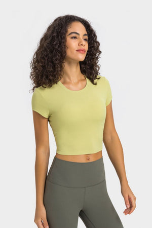 Ribbed crewneck crop top in lemon with short sleeves.