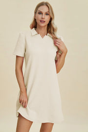 Ivory textured V-neck short sleeve mini dress with geometric pattern