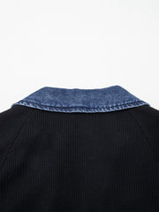 Black textured knit polo top with denim collar detail