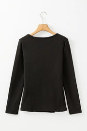 Black long sleeve thermal top with a scoop neckline.