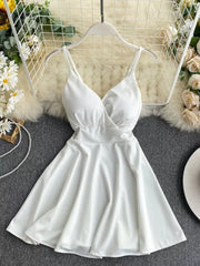 White V-neck spaghetti strap mini dress with adjustable straps and a flared skirt.