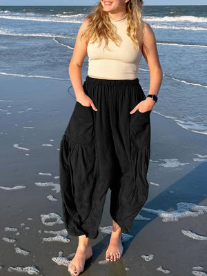 Black linen balloon trousers with cargo pockets and drawstring waist