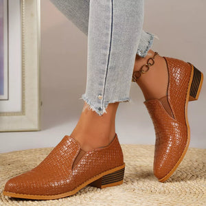 Tan woven texture pointed loafers with block heels and elastic side panels.