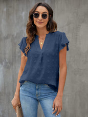 Textured voile flutter sleeve blouse in dark blue with a v-neck and dotted pattern.