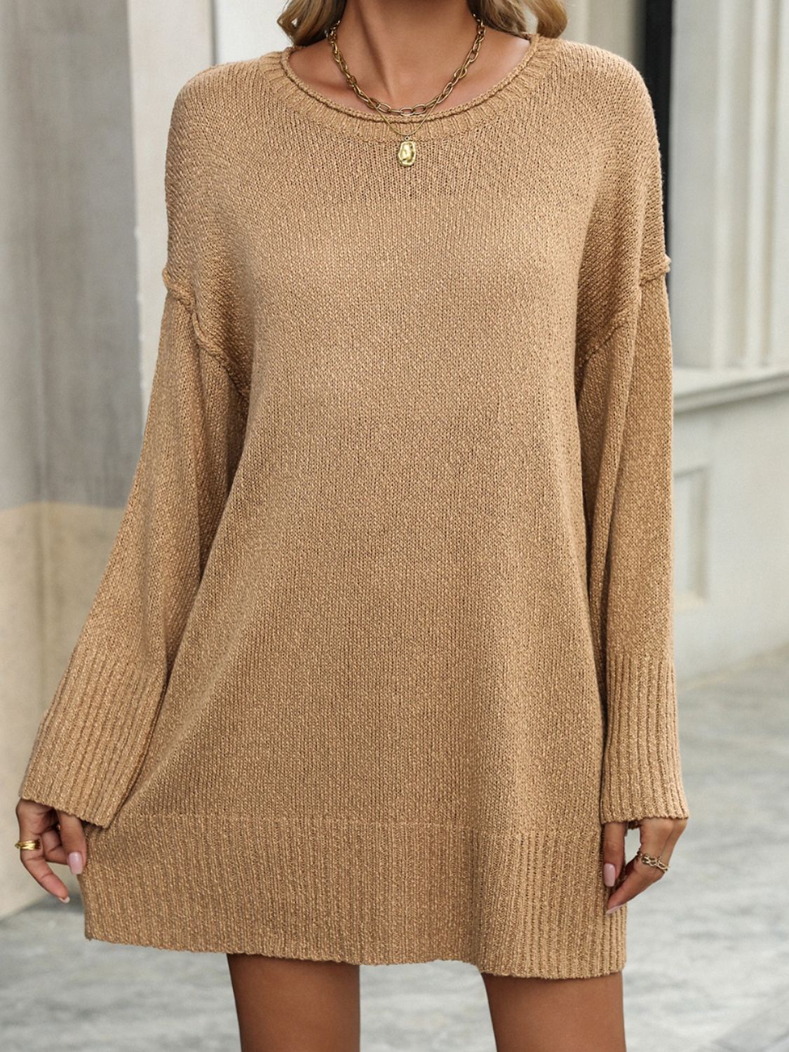 Oversized camel ribbed knit tunic sweater with crew neck and long sleeves.