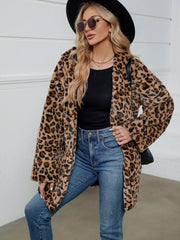 Leopard print faux fur cocoon coat with open front and relaxed fit.