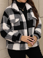 Textured plaid shacket with fluffy collar in black and white, featuring chest pockets and a button front.