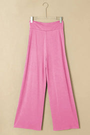 Pink wrap-front palazzo pants with a slit hem and wide leg