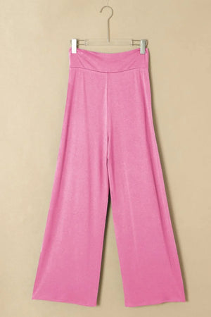 Pink wrap-front palazzo pants with a slit hem and wide leg