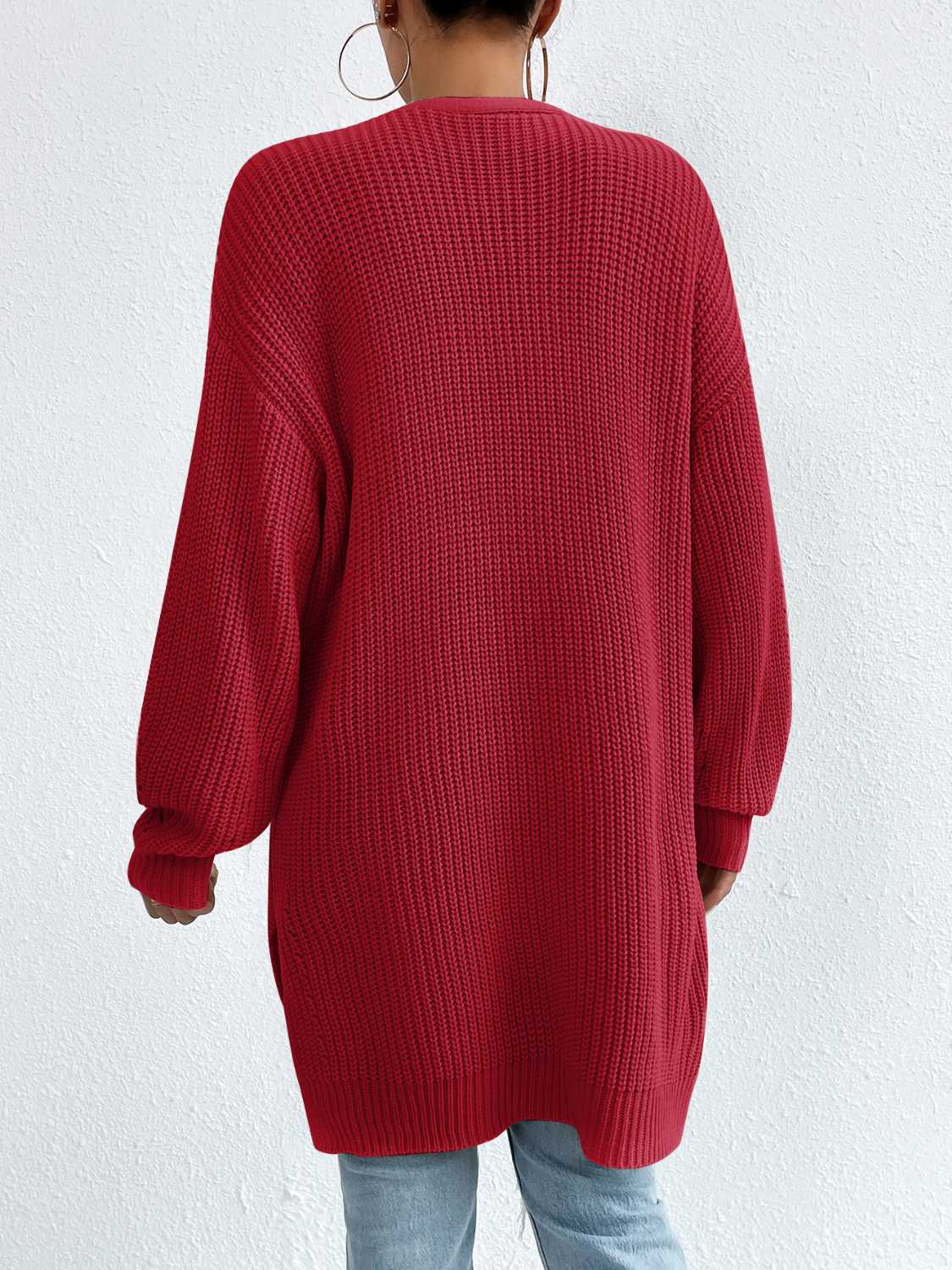 Longline knit open cardigan in Deep Red with ribbed texture and long sleeves.