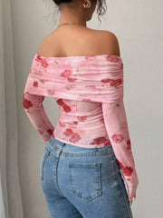 Pink floral mesh off-shoulder top with ruched detail and long sleeves.
