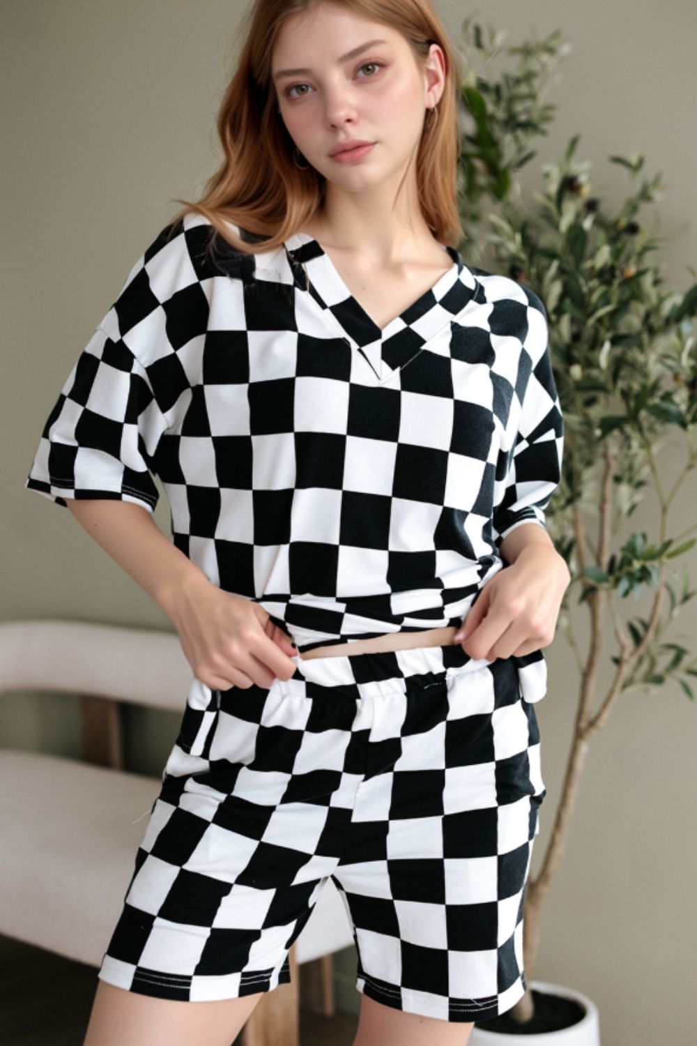 Black and white checkered v-neck t-shirt and shorts outfit set