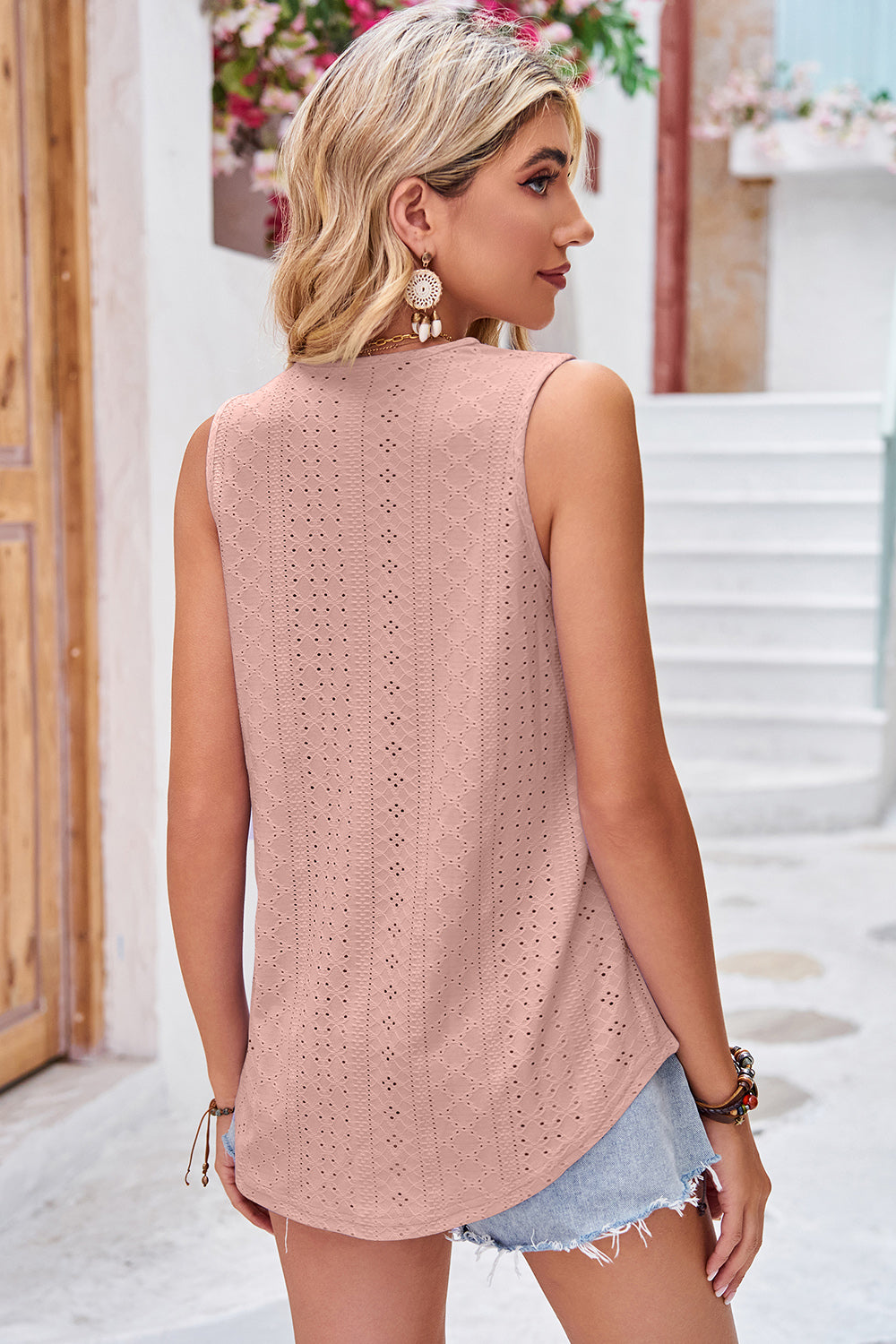 Dusty pink lace trim eyelet v-neck tank top with a curved hem.