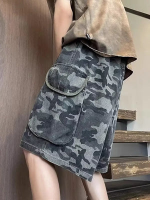 Relaxed fit black camo cargo shorts with large flap pockets.